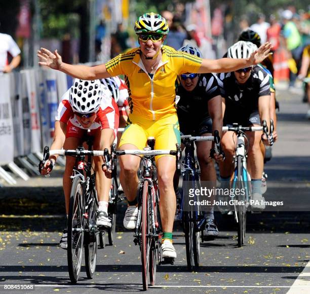 Australia's Rochelle Gilmore celebrates as she crosses the line to win ahead of England's Lizzie Armitstead in second in the 112km Women's Road Race...