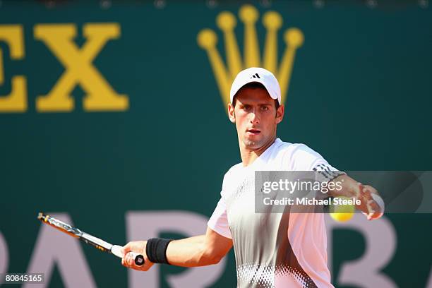 Novak Djokovic of Serbia on his way to winning 6-0,6-4 in the third round against Andy Murray of Great Britain on day six of the Masters Series at...