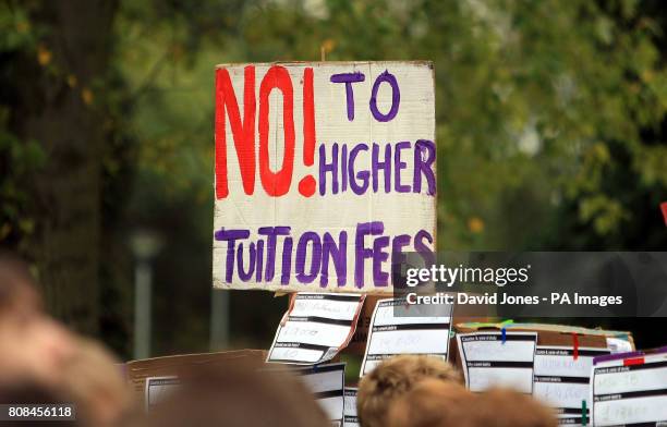 Students at the University of Birmingham march to a barrier constructed on campus to symbolize the barrier that the Browne report poses to higher...