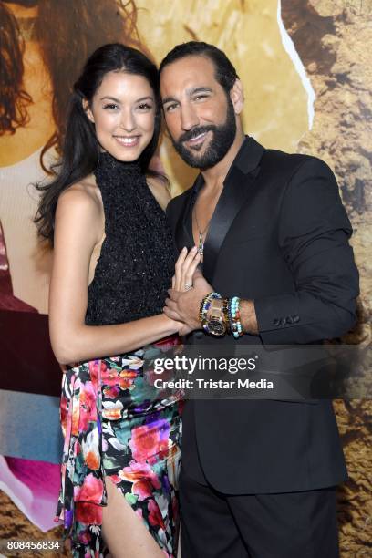 Rebecca Mir and her husband Massimo Sinato attend the Lena Hoschek show during the Mercedes-Benz Fashion Week Berlin Spring/Summer 2018 at Kaufhaus...