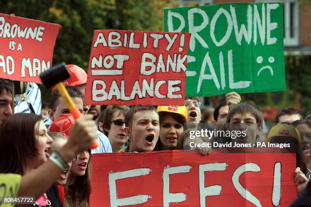 Students at the University of Birmingham march to a barrier constructed on campus to symbolize the barrier that the Browne report poses to higher...