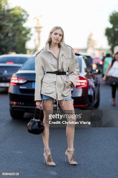 Elena Perminova wearing a trench jacket outside Alexandre Vauthier during Paris Fashion Week - Haute Couture Fall/Winter 2017-2018 : Day Three on...