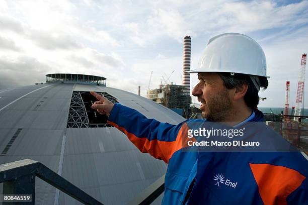 Nicola Brancaleoni, from the Enel Energy Management General Division shows the silvery dome of theTorrevaldaliga Nord Enel Coal Plant is seen on...
