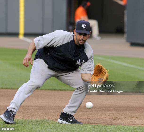 Catcher Jorge Posada of the New York Yankees takes gorund balls at firstbase prior to a game on April 19, 2008 against the Baltimore Orioles at...