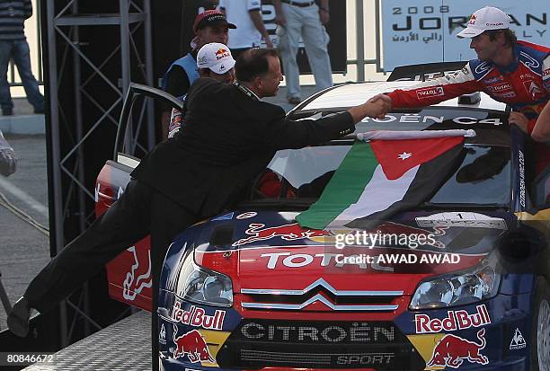 Prince Faisal bin al-Hussein of Jordan shakes hands with Four-time world champion Sebastien Loeb before the ceremonial start of the 2008 Jordan Rally...