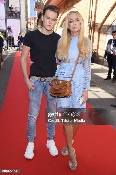 Jenny Elvers and her son Paul Jolig attend the Riani Fashion Show Spring/Summer 2018 at Umspannwerk Kreuzberg on July 4, 2017 in Berlin, Germany.