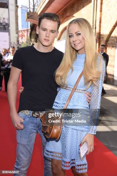 Jenny Elvers and her son Paul Jolig attend the Riani Fashion Show Spring/Summer 2018 at Umspannwerk Kreuzberg on July 4, 2017 in Berlin, Germany.