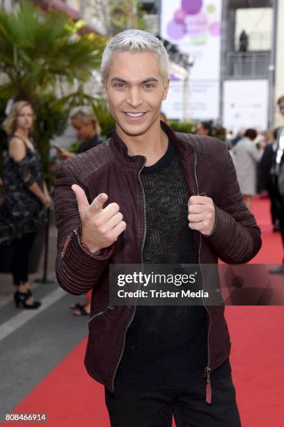 Julian David attends the Riani Fashion Show Spring/Summer 2018 at Umspannwerk Kreuzberg on July 4, 2017 in Berlin, Germany.