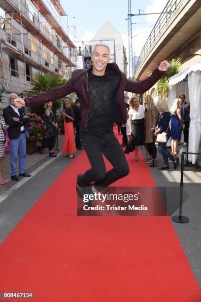 Julian David attends the Riani Fashion Show Spring/Summer 2018 at Umspannwerk Kreuzberg on July 4, 2017 in Berlin, Germany.