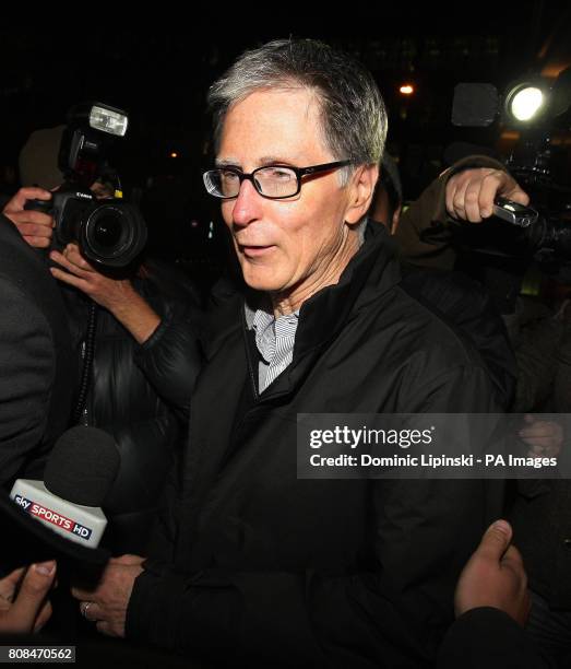 John W Henry leaves the offices of law firm Slaughter and May, in the city of London.