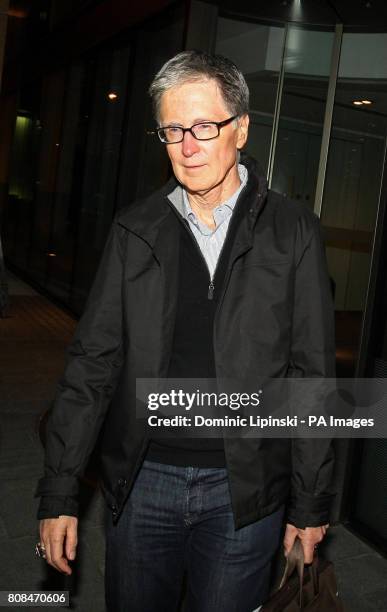 John W Henry leaves the offices of law firm Slaughter and May, in the city of London.