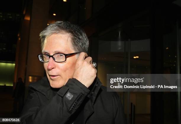 John W Henry leaves the offices of law firm Slaughter and May, in the city of London.