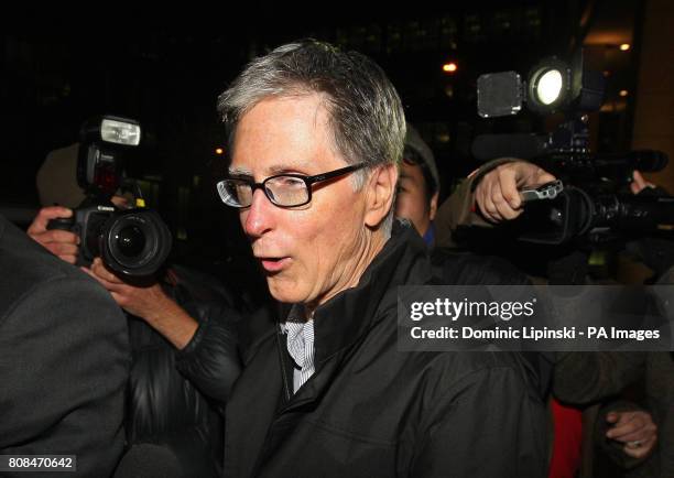 John W Henry leaves the offices of law firm Slaughter and May, in the city of London.