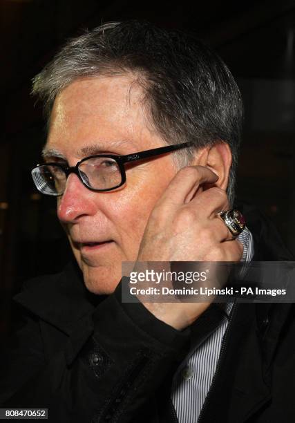 John W Henry leaves the offices of law firm Slaughter and May, in the city of London.