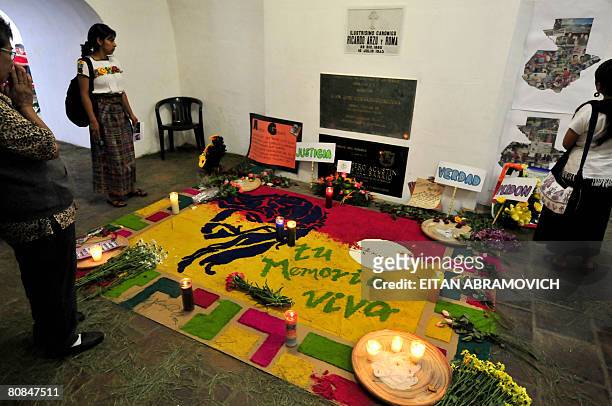 Women visit the crypt where Monsignor Juan Jose Gerardi is buried in Guatemala's Metropolitan Cathedral on April 24, 2008 in Guatemala City. A...