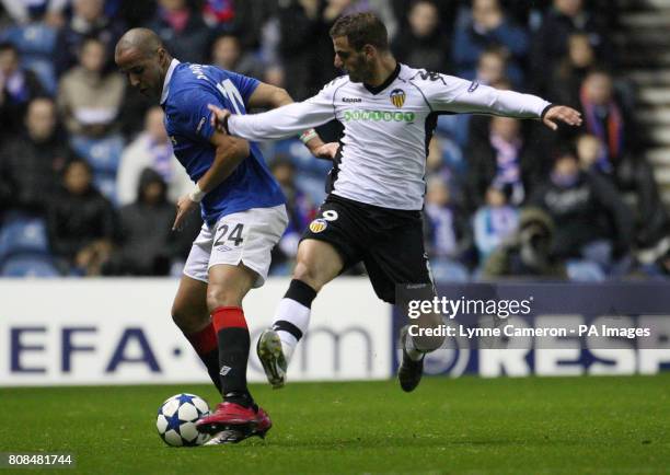 Valencia's Roberto Soldado and Rangers' Madjid Bougherra during the UEFA Champions League match at Ibrox, Glasgow.