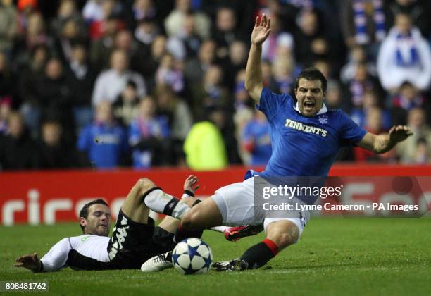 Valencia's Roberto Soldado and Rangers' Richard Foster during the UEFA Champions League match at Ibrox, Glasgow.