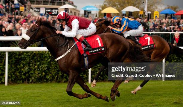 Casamento ridden by Frankie Dettori on their way to winning The Racing Post Trophy at Doncaster Racecourse, Doncaster.