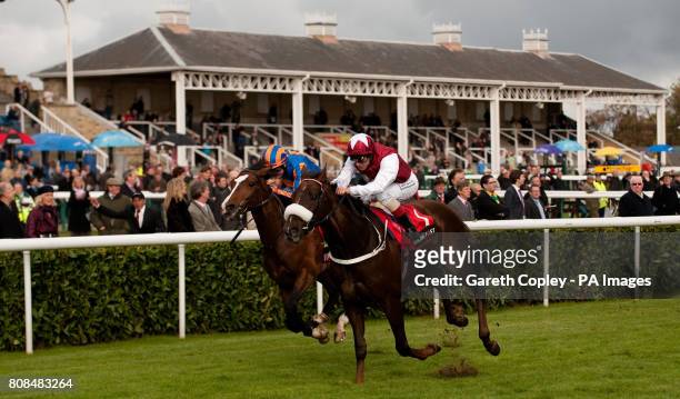 Casamento ridden by Frankie Dettori on their way to winning The Racing Post Trophy at Doncaster Racecourse, Doncaster.