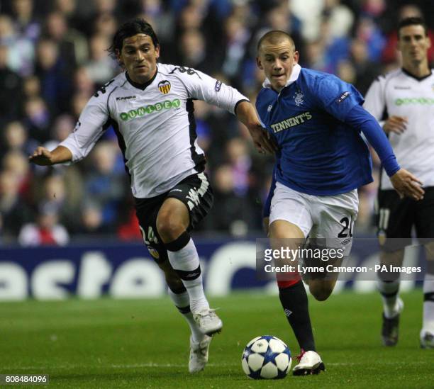 Rangers' Vladimir Weiss and Valencia's Mehmet Topal during the UEFA Champions League match at Ibrox, Glasgow.
