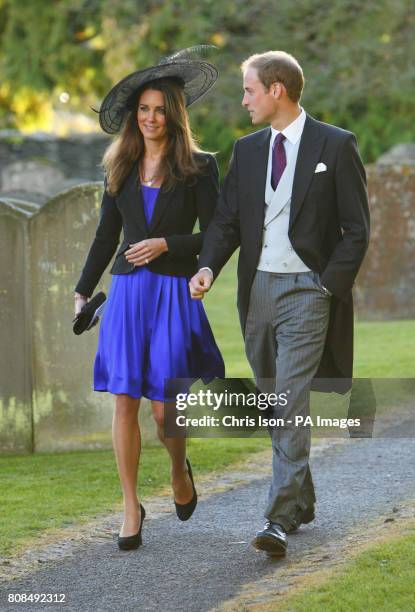 Prince William and Kate Middleton leave the wedding of their friends Harry Mead and Rosie Bradford in the village of Northleach, Gloucestershire.