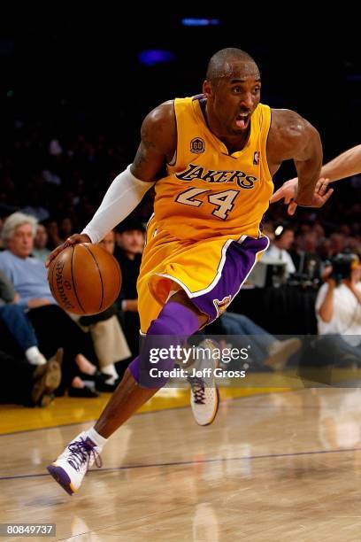 Kobe Bryant of the Los Angeles Lakers drives to the basket in Game Two of the Western Conference Quarterfinals against the Denver Nuggets during the...