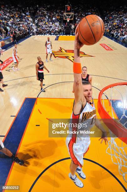 Andris Biedrins of the Golden State Warriors dunks against the Portland Trail Blazers during the game at Oracle Arena on March 27, 2008 in Oakland,...