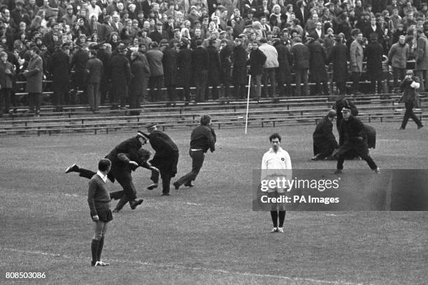 Some of the best Rugby action came from the police and anti demonstrators as players wait for the latest pitch invasion to end. Scotland won the...