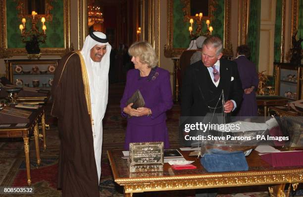 The Prince of Wales and the Duchess of Cornwall show Prime Minister and Foreign Minister of Qatar His Excellency Sheikh Hamad bin Jassim round...