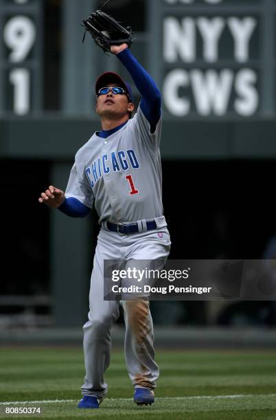 Rightfielder Kosuke Fukudome of the Chicago Cubs catches a pop fly by Chris Iannetta of the Colorado Rockies in foul territory in the second inning...