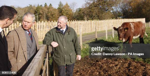 The Prince of Wales, Duke of Rothesay, speaks with Morrisons Chief Executive Dalton Philips and Farm Manager Jim Holden during a visit to the...