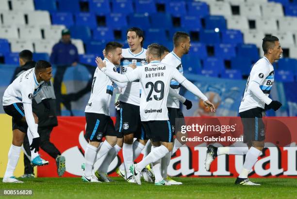 Ramiro of Gremio celebrates with teammates after scoring the opening goal of his team during a first leg match between Godoy Cruz and Gremio as part...