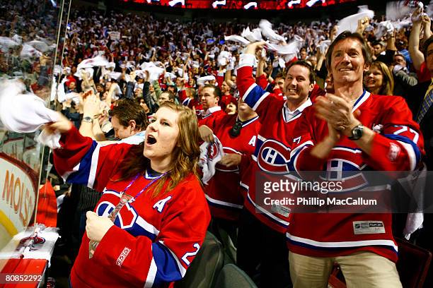 Fans of the Montreal Canadiens celebrate a late game tying goal against the Philadelphia Flyers in Game One of the Eastern Conference Semifinals of...