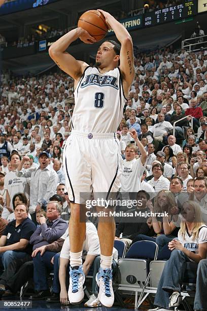 Deron Williams of the Utah Jazz hits a three-pointer against the Houston Rockets in Game Three of the Western Conference Quarterfinals during the...