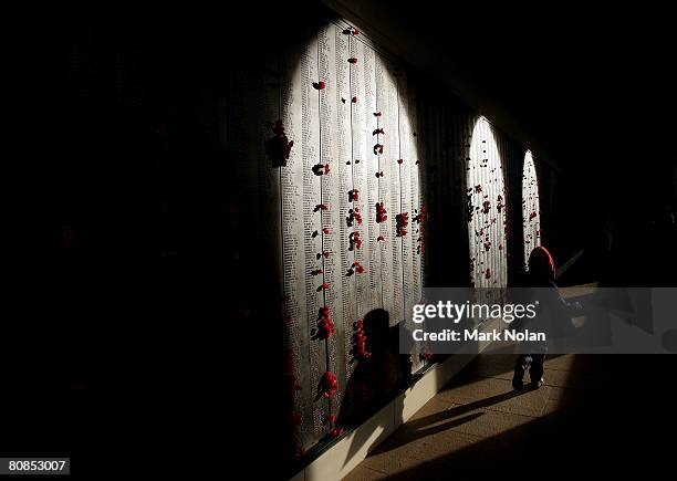 Child walks past the Roll of Honour for World War I after the ANZAC Day Dawn Service at the Australian War Memorial on April 25, 2008 in Canberra,...