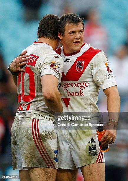 Brett Morris of the Dragons celebrates with his brother Josh Morris after winning the round seven NRL match between the St George Illawarra Dragons...