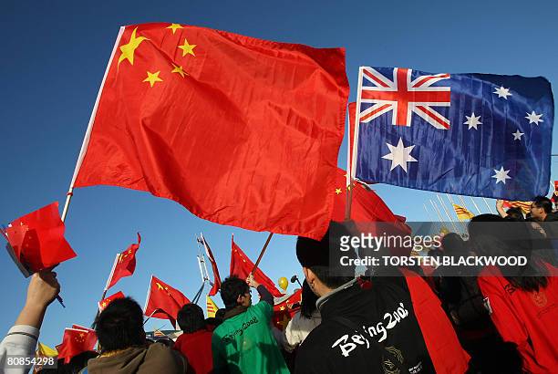 Thousands of Chinese supporters rally outside Parliament House during the Beijing 2008 Olympic torch relay through Canberra on April 24, 2008....