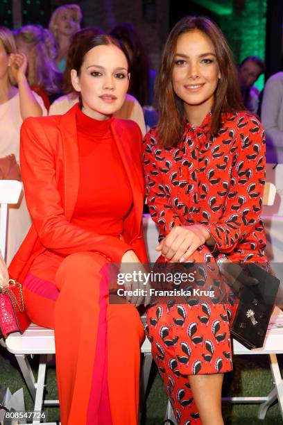 Emilia Schuele and Janina Uhse attend the Marc Cain Fashion Show Spring/Summer 2018 at ewerk on July 4, 2017 in Berlin, Germany.