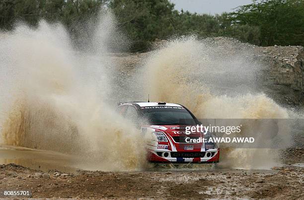 Four-time world champion Sebastien Loeb and co-driver Daniel Elena power their Citroen C4 through the start of the 2008 Jordan Rally in the Dead Sea...