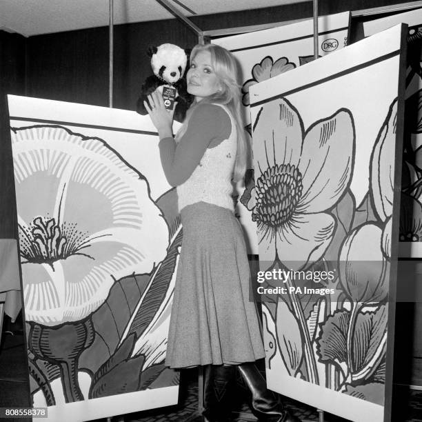 Former Miss World, Eva Rueber-Staier, with the symbol of the World Wildlife Fund at a reception in London to launch a new range of paper cups...