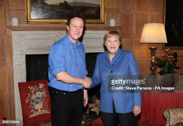 Prime Minister David Cameron speaks with German Chancellor Angela Merkel at Chequers in Buckinghamshire.