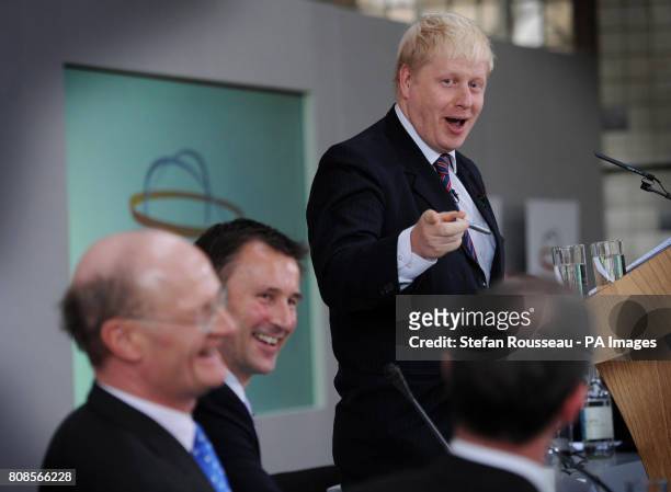 London Mayor Boris Johnson shares a joke with Secretary of State for Culture, Olympics, Media and Sport Jeremy Hunt and Universities and Science...