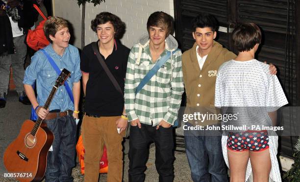 The boy band One direction, who are contestants in the TV show the X Factor leaves the Fountain Studios in Wembley north West London, after the live...