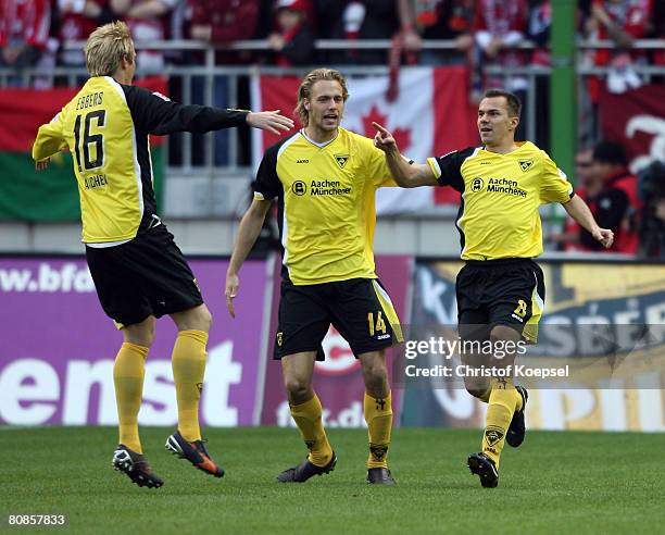Szilard Nemeth of Aachen celebrates the first goal with Marius Ebbers and Daniel Brinkmann during the Second Bundesliga match between 1. FC...