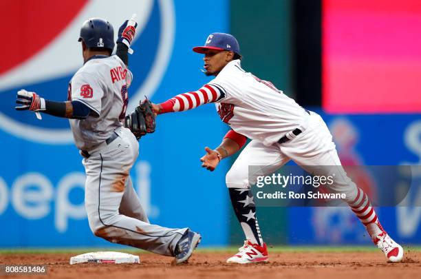 Francisco Lindor of the Cleveland Indians tags out Erick Aybar of the San Diego Padres on a fielders choice by Cory Spangenberg during the fifth...