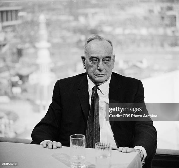 American public official and city planner Robert Moses sits at a table at the 1964/1965 New York World's Fair site on an episode of the television...