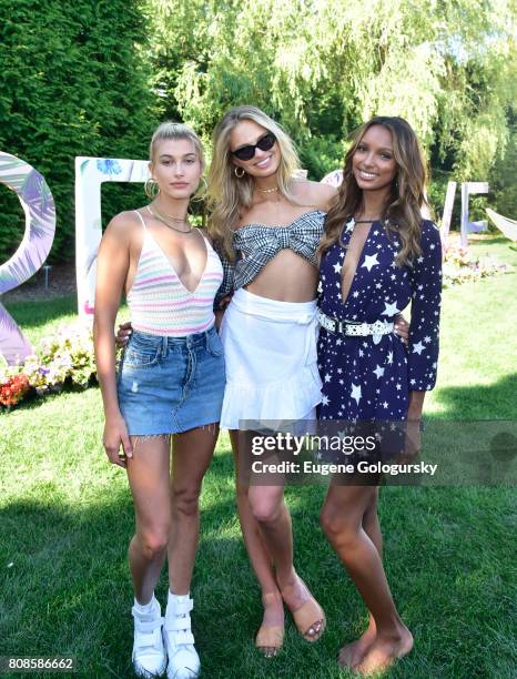 Hailey Baldwin, Romee Strijd, and Jasmine Tookes attend the FIJI Water At #REVOLVEintheHamptons 2017 on July 4, 2017 in Bridgehampton, New York.