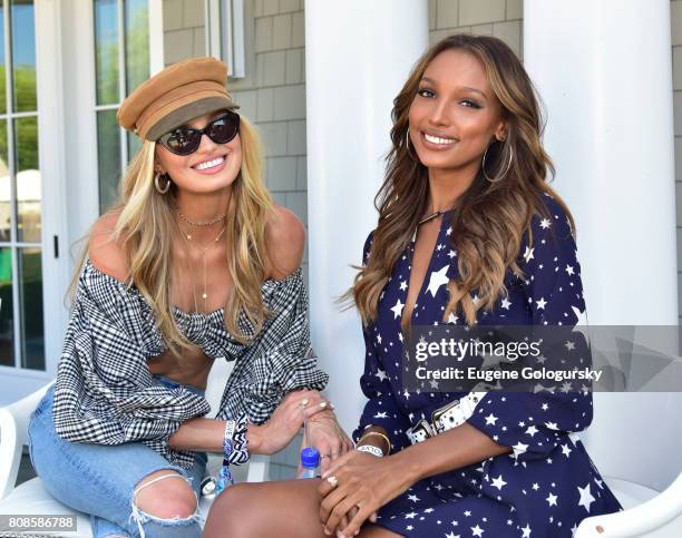 Romee Strijd and Jasmine Tookes attend the FIJI Water At #REVOLVEintheHamptons 2017 on July 4, 2017 in Bridgehampton, New York.