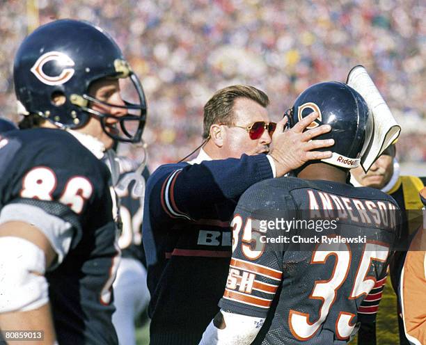 Chicago Bears Head Coach, Mike Ditka, talks to RB, Neal Anderson, during a 1992 game against the Green Bay Packers at Soldier Field in Chicago,...