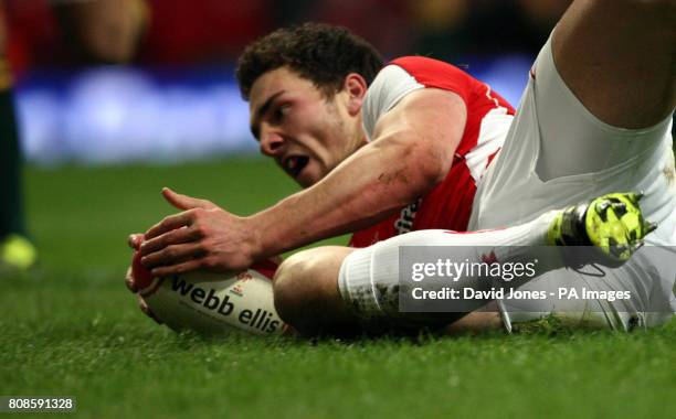 Wales's 18 yearr bold debutante George North breaks through to score the opening try during the Investec Perpetual Series match at the Millennium...